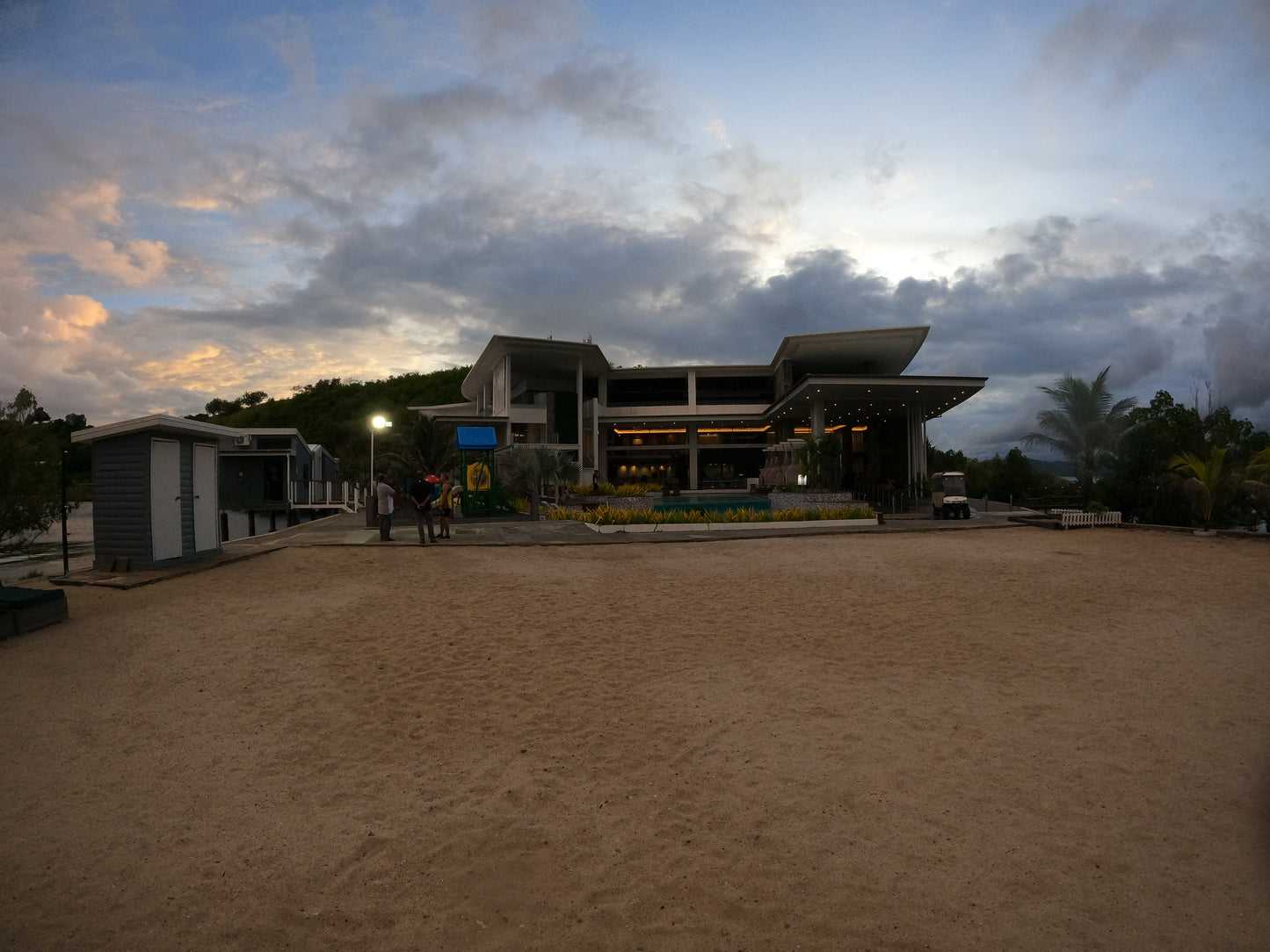 Loloata Resort view over pool at sunset