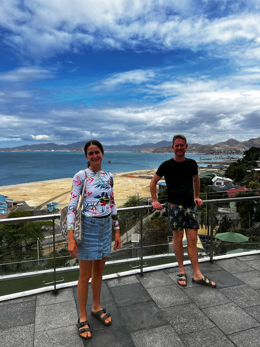 Lunch overlooking Port Moresby Harbour two people posing