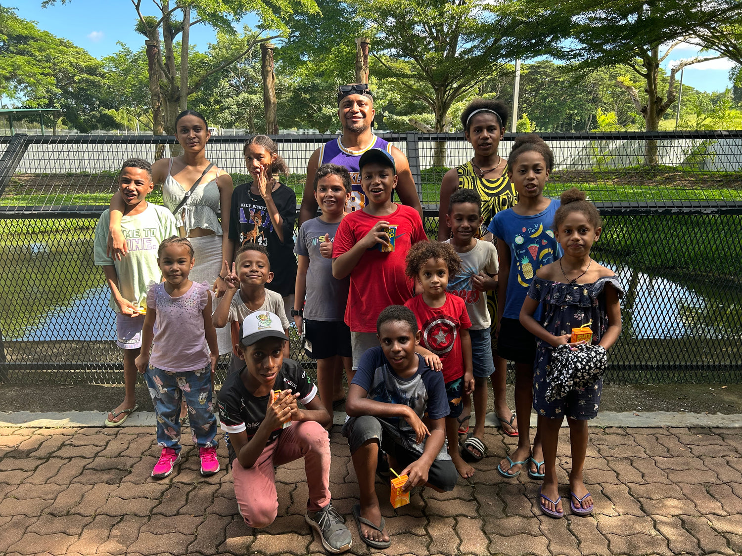 Port Moresby Adventure Park kids in front of the crocodile enclosure