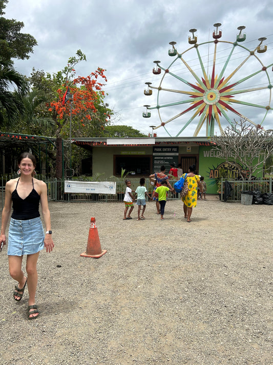 Port Moresby Adventure Park woman at entrance in front of ferris wheel