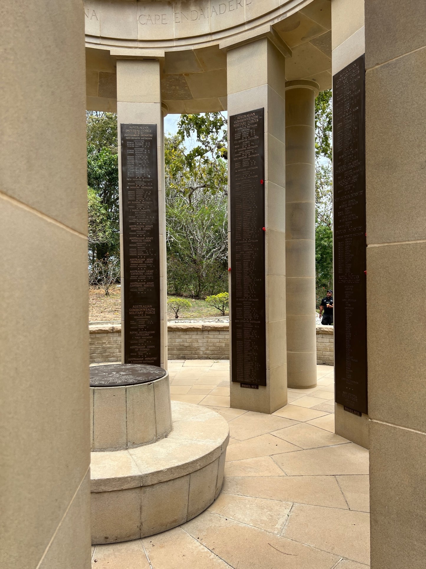 Memorial with columns and plaques in a park-like setting