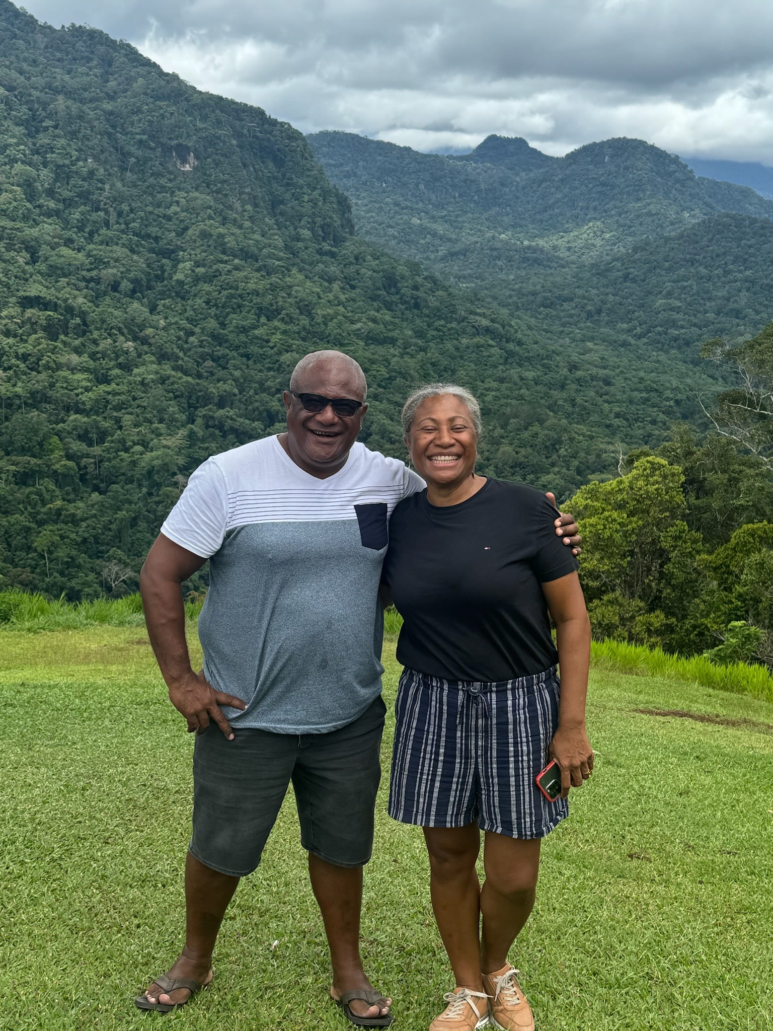 Kokoda Track Finish two people posing in front of valley