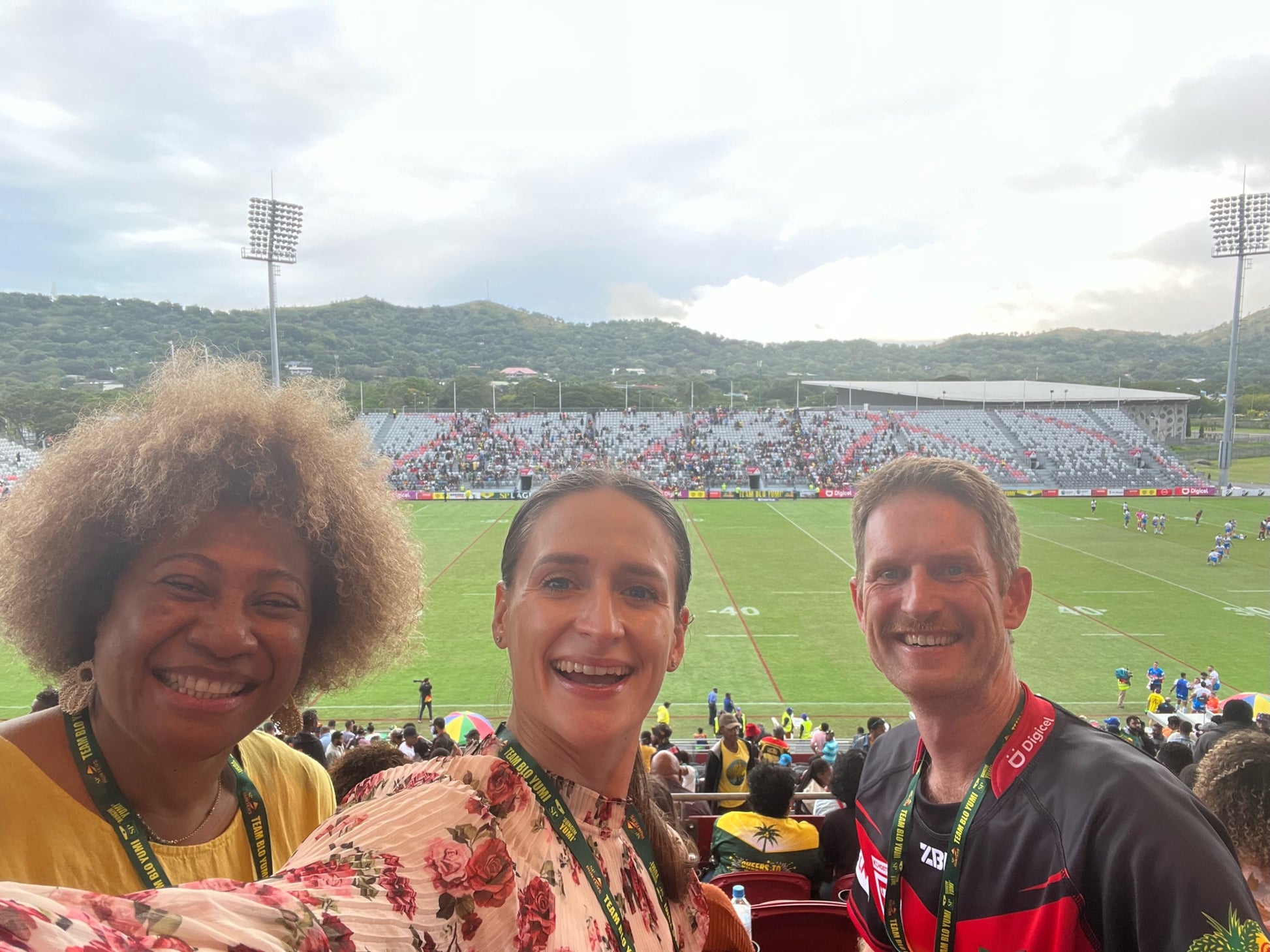 PNG Hunters Erue, Britt, Nathan in grandstand with field in background