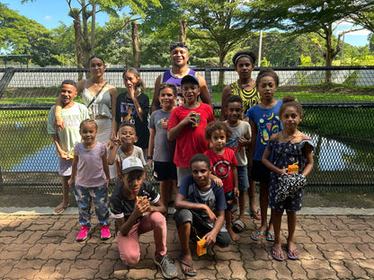 Port Moresby Adventure Park kids in front of the crocodile enclosure
